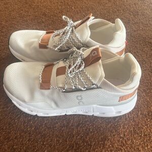 On Running Cream and Brown Sneakers